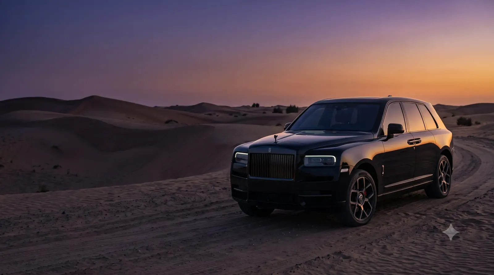 Rolls-Royce Cullinan Black Badge on a desert track at dusk